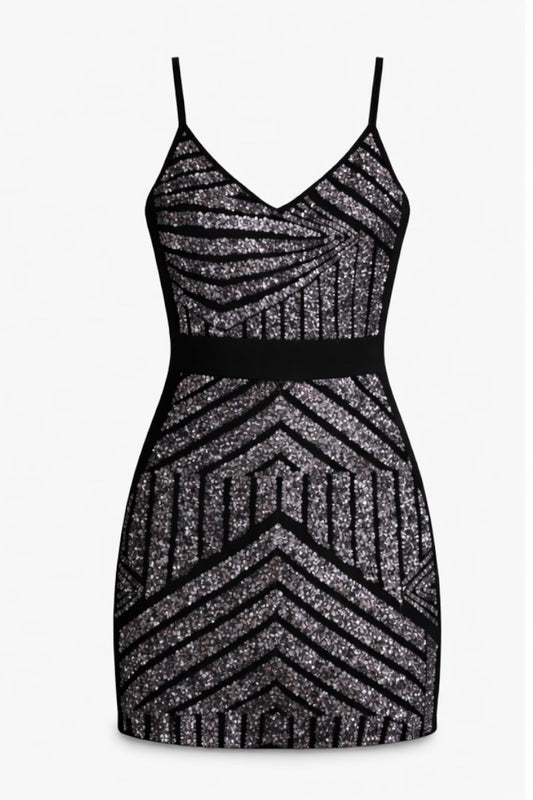 Black and silver zigzag patterned dress on a white background