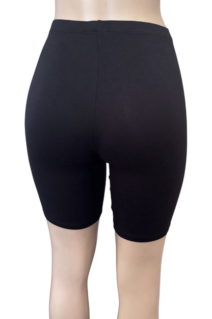Black shorts worn by a person on a white background