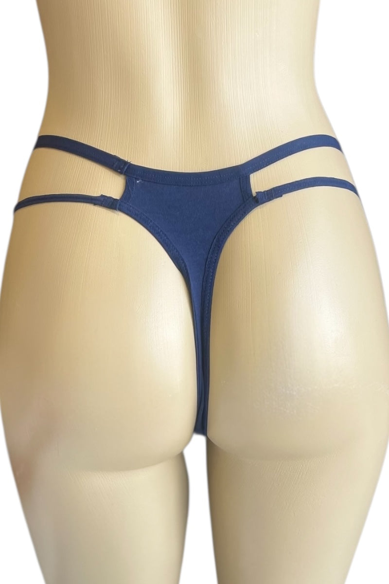 Navy Blue thong on a beige mannequin against a white background