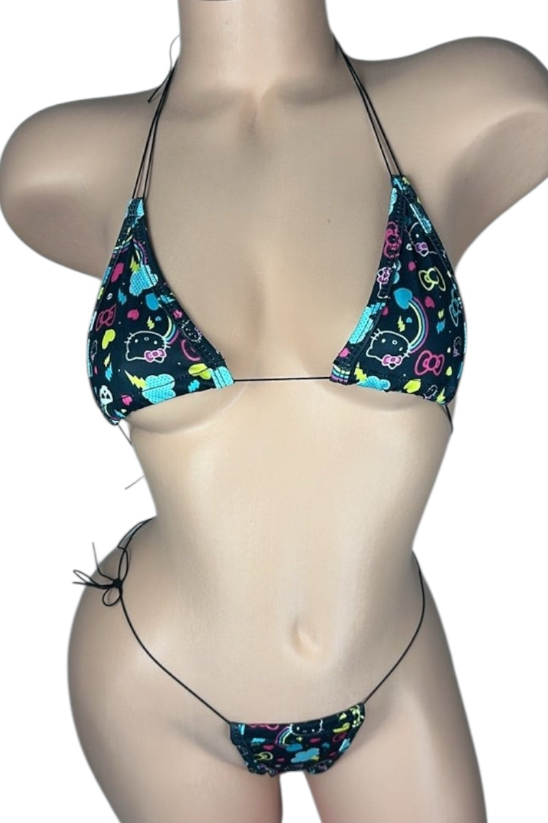Bikini set with colorful pattern on a mannequin against a white background