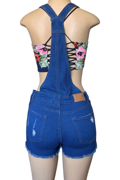 Blue denim overalls worn by a mannequin on a white background