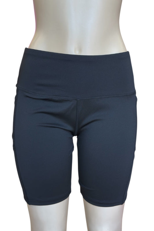 Black athletic shorts on a mannequin against a white background
