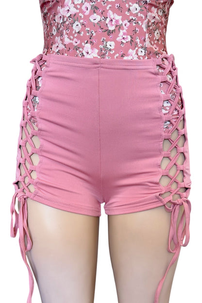 Pink shorts with lattice design on a white background
