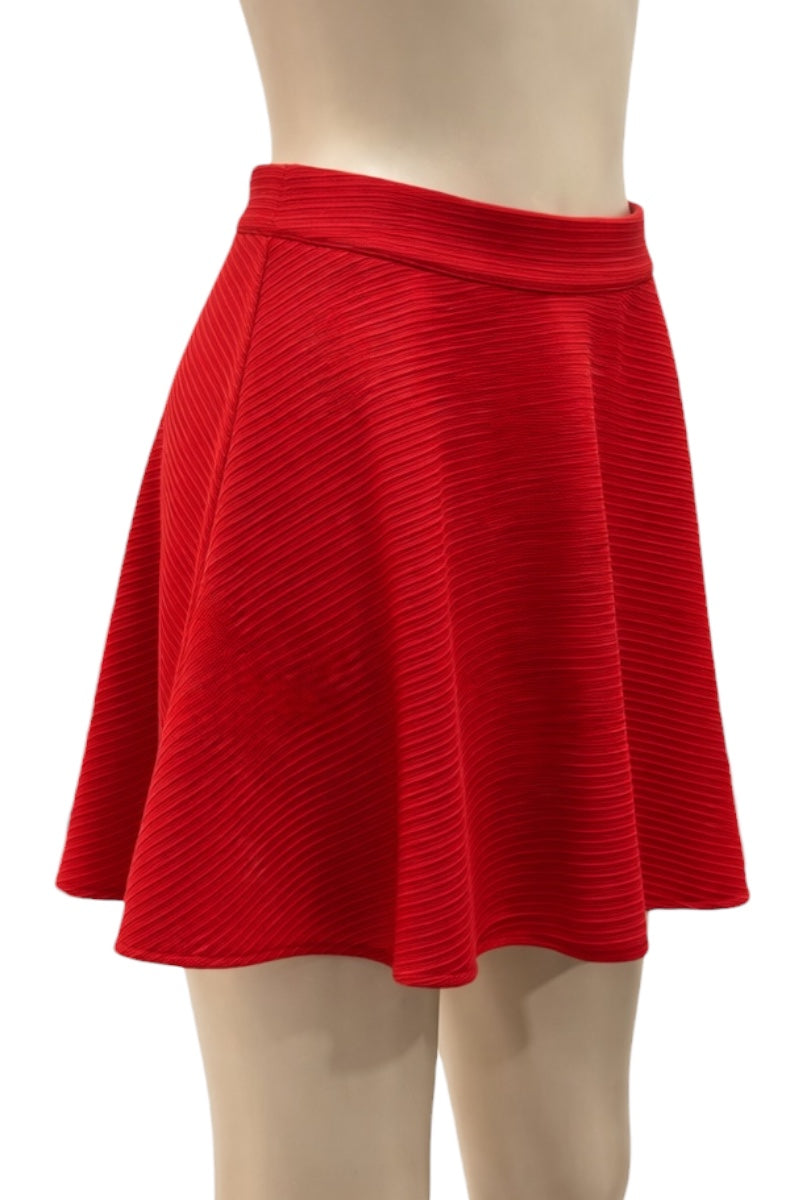 Red skirt on a mannequin against a white background