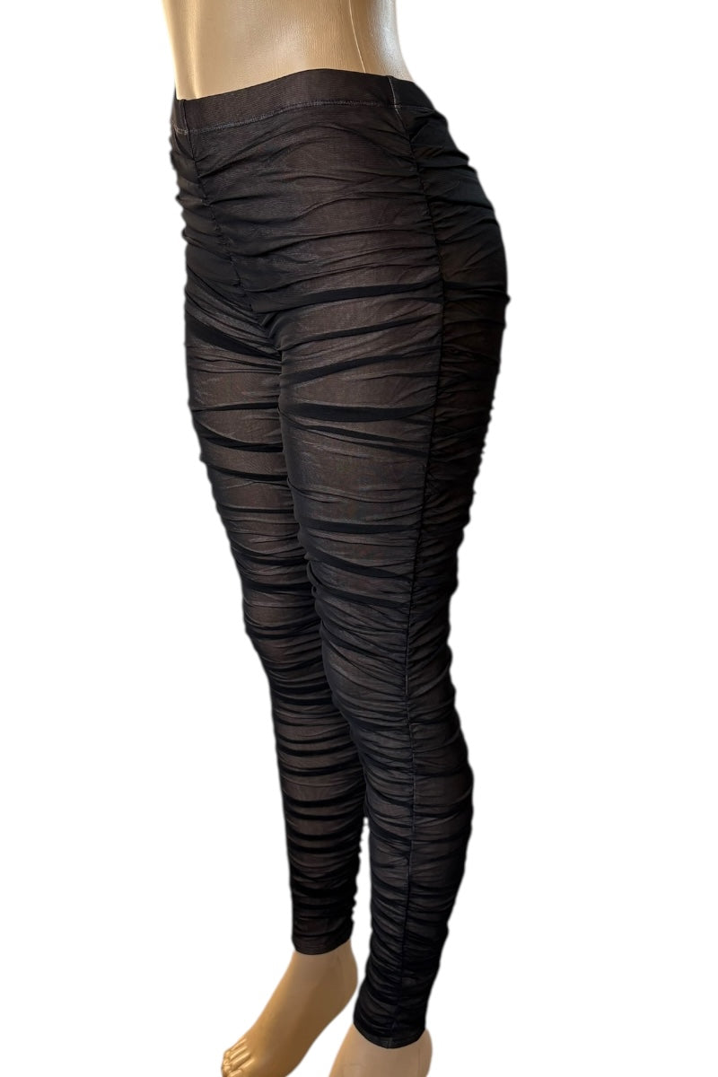 Black ruched leggings on a mannequin against a white background