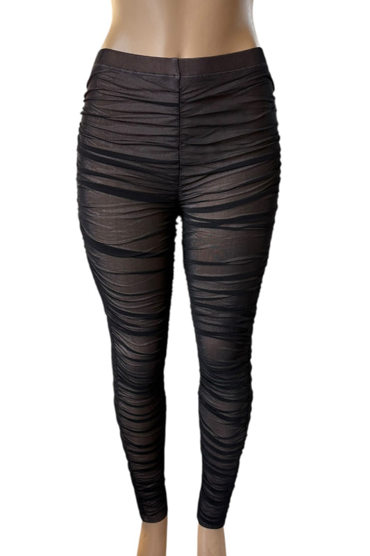 Black ruched leggings on a white background