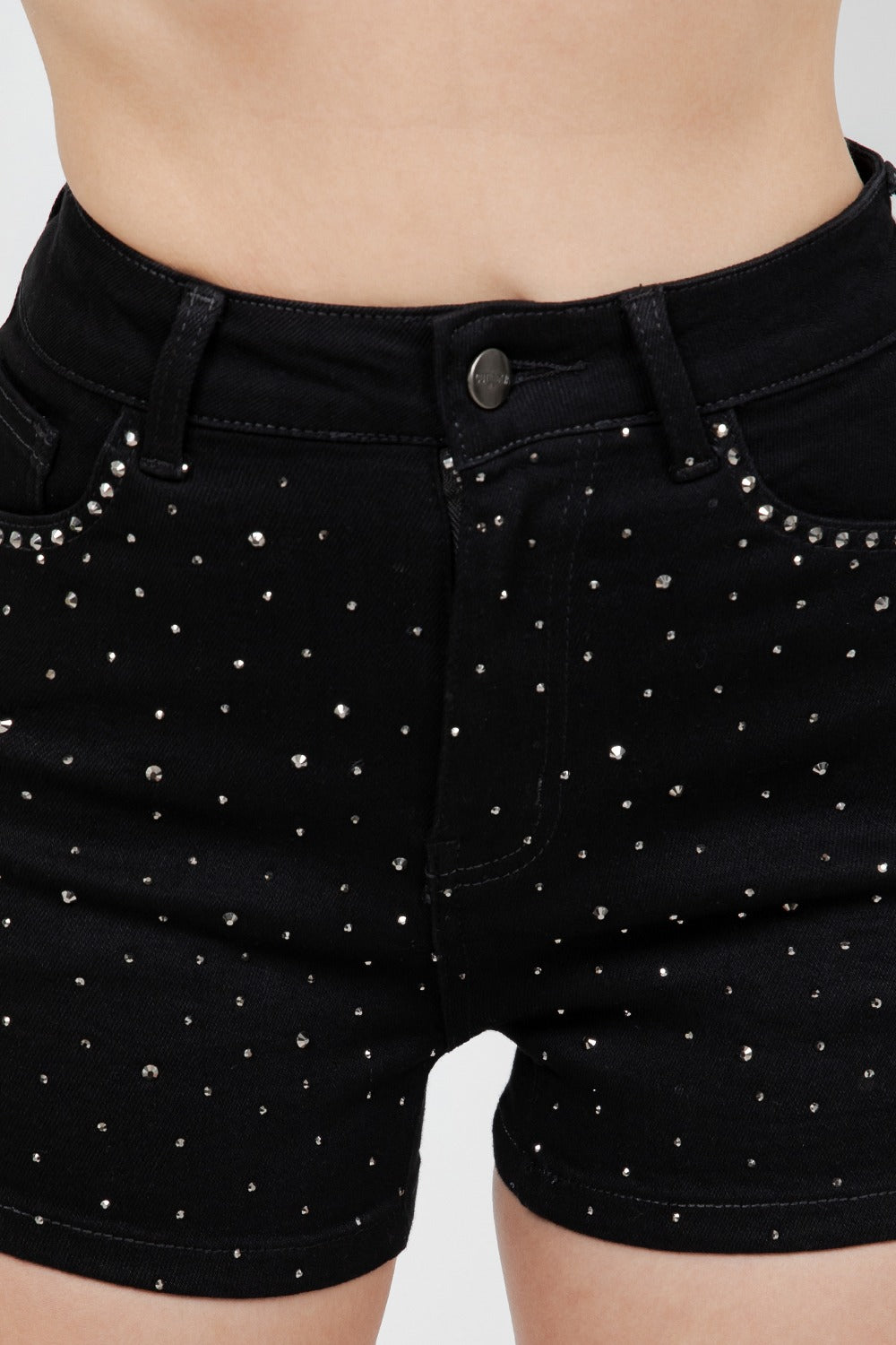 Black shorts with rhinestone embellishments on a plain background