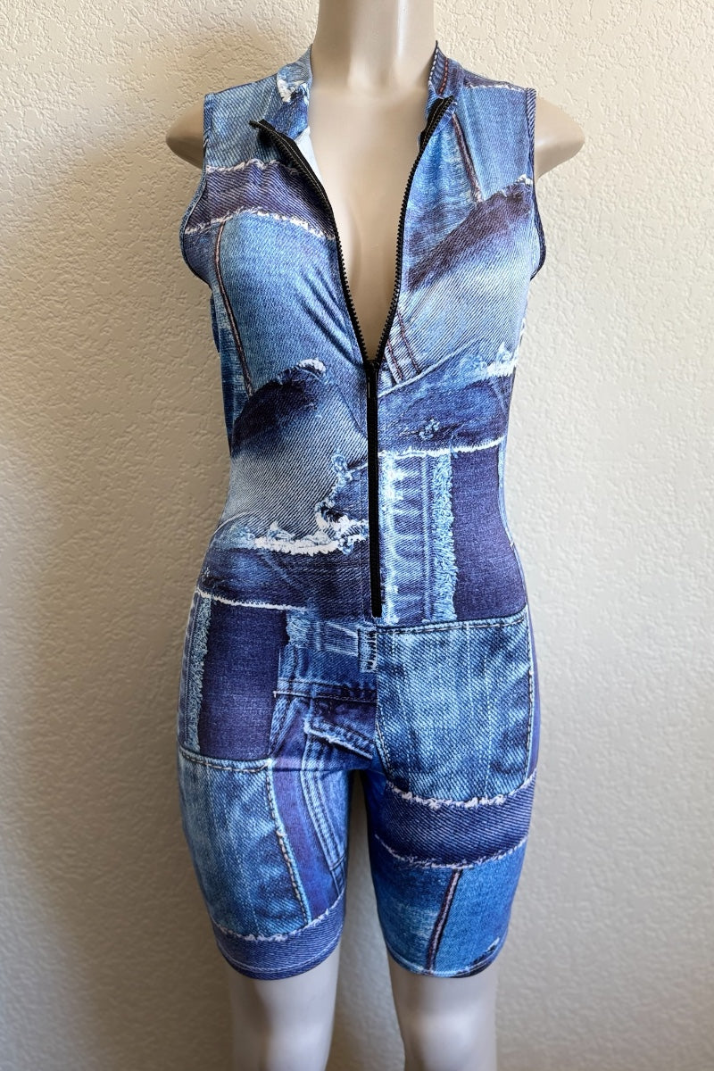 Mannequin wearing a denim-patterned sleeveless romper against a plain background