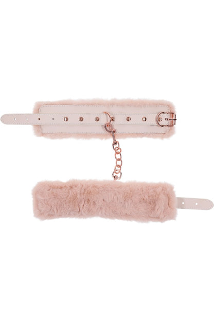 Pink fur belt with chain on a white background