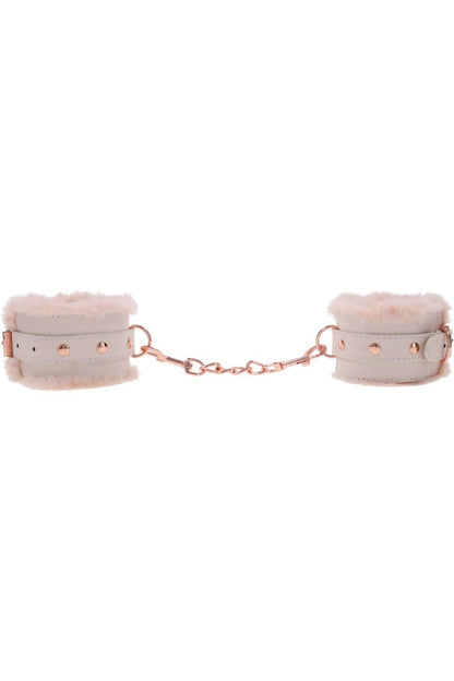 Pink handcuffs with chain on a white background