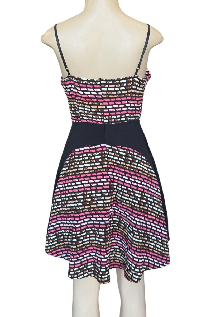 Patterned dress on a mannequin against a white background
