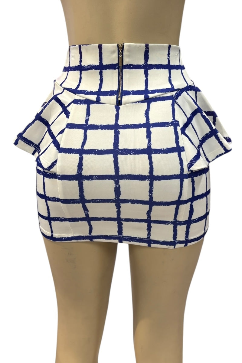 White skirt with blue grid pattern on a mannequin