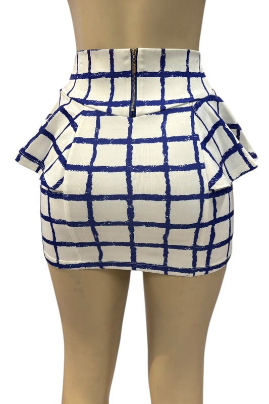 White skirt with blue grid pattern on a mannequin