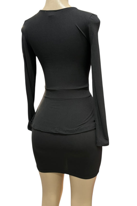 Black dress on a mannequin against a white background