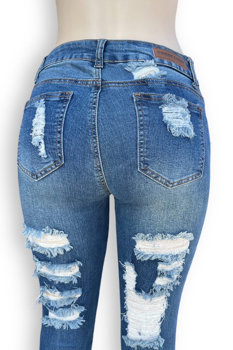 Super Distressed Mid Rise Jeans