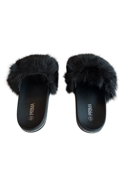 Black fluffy slippers on a white background