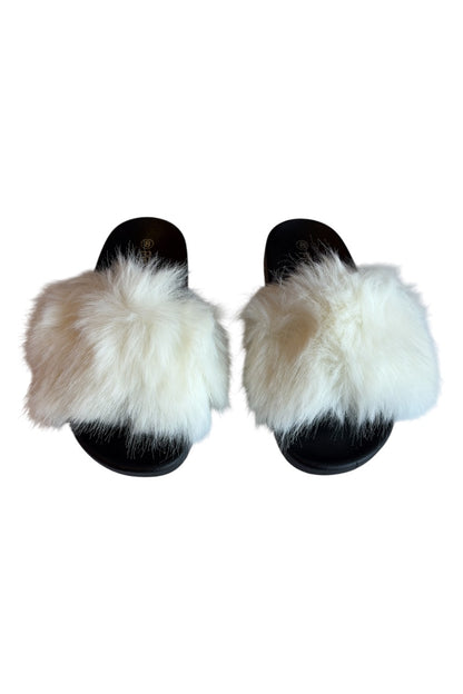 Pair of slippers with fluffy white fur on a white background
