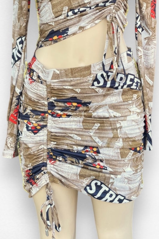 Mannequin wearing a patterned skirt with 'STREET' text on a white background