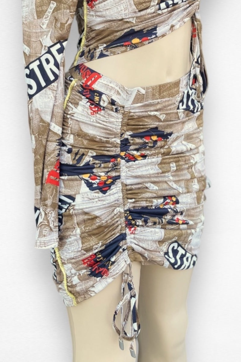 Mannequin wearing a patterned skirt with text and graphics on a white background