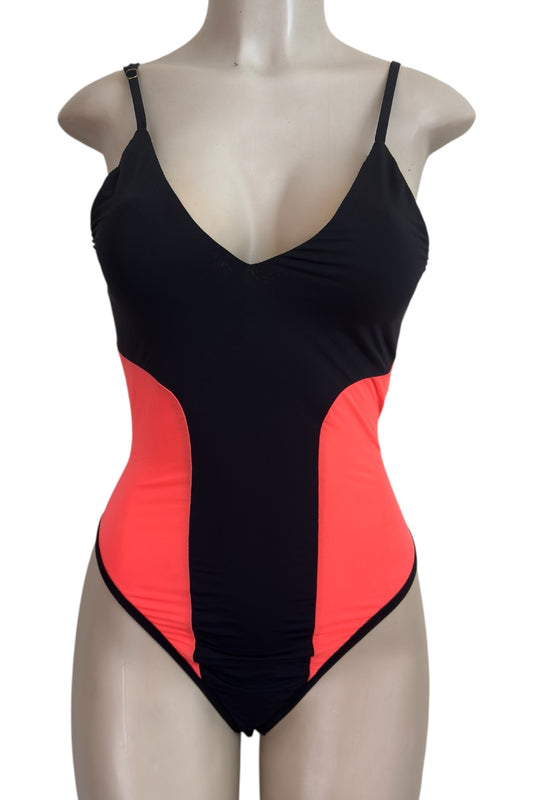 Black and orange bodysuit on a mannequin against a white background