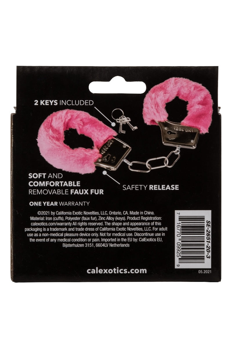 Pink faux fur handcuffs with keys on a black Calexotics packaging