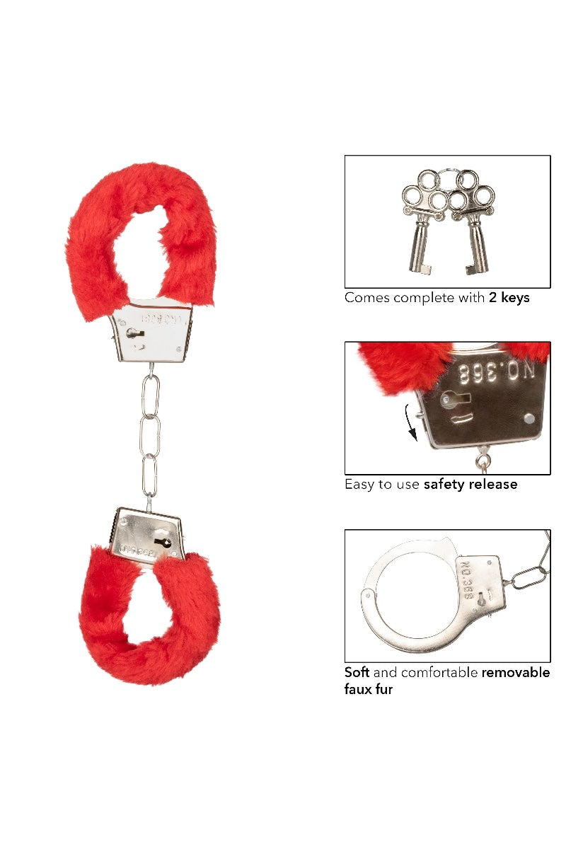 Red fluffy handcuffs with keys on a white background