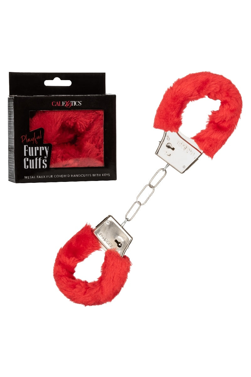 Red furry cuffs with metal clasps and packaging on a white background