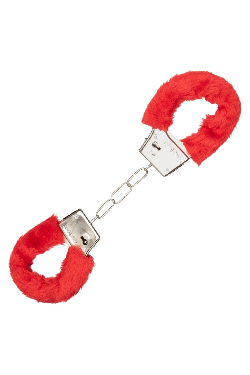 Red fluffy handcuffs on a white background
