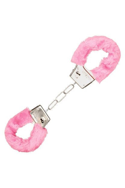 Pink fluffy handcuffs on a white background