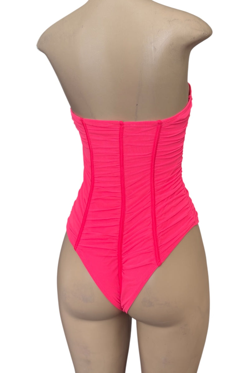 Neon pink bodysuit on a mannequin with a white background