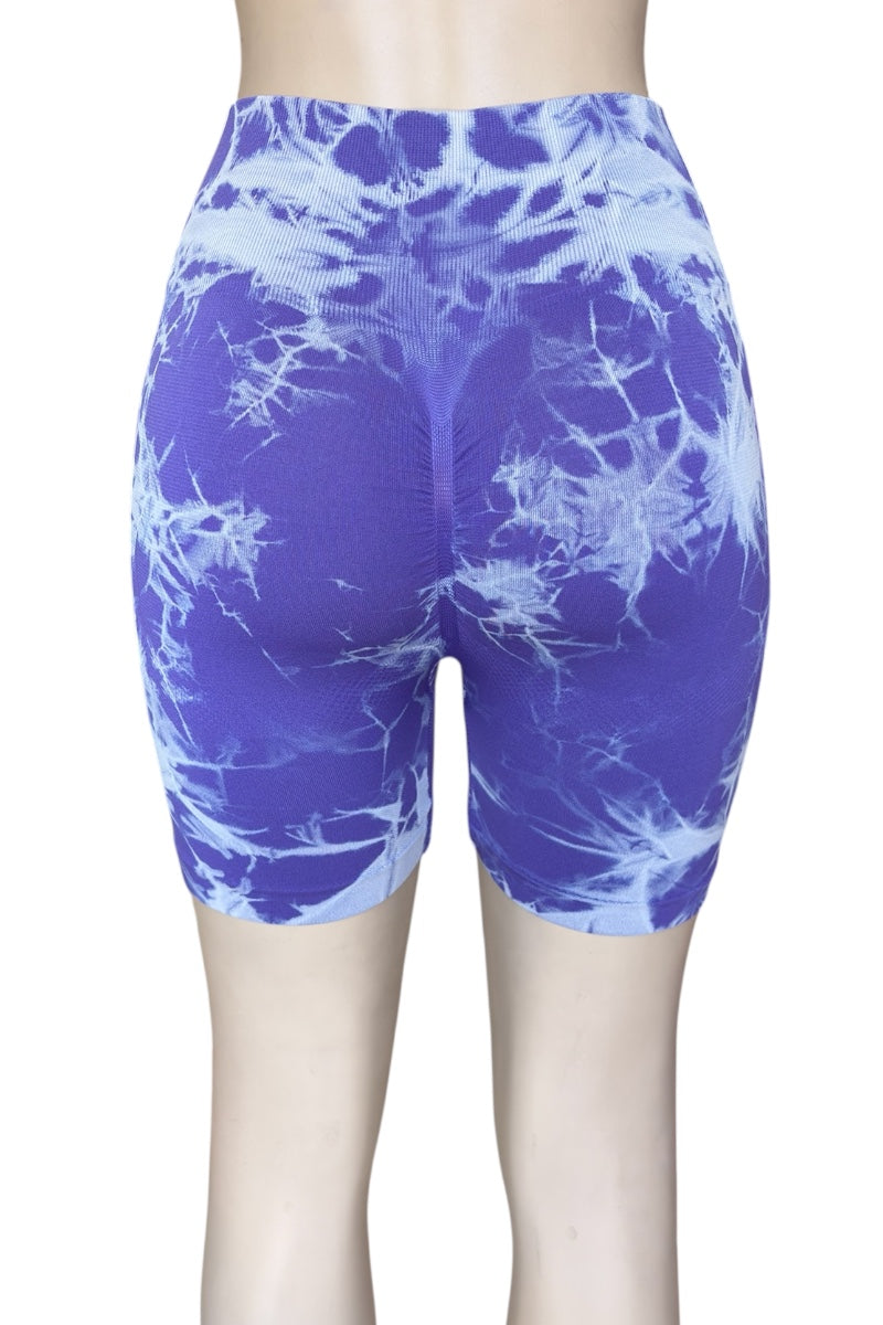 Purple tie-dye shorts on a white background