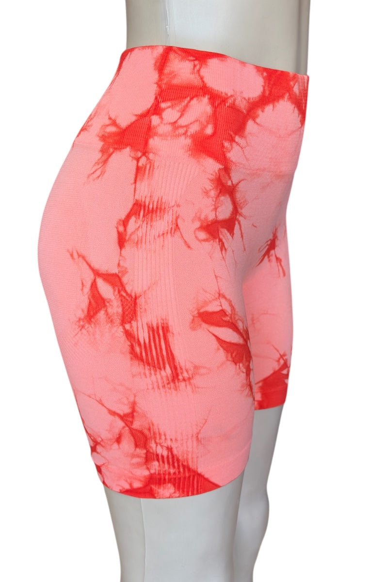 Mannequin wearing a orange tie-dye skirt on a white background