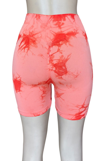 Orange Tie-dye shorts on a mannequin against a white background