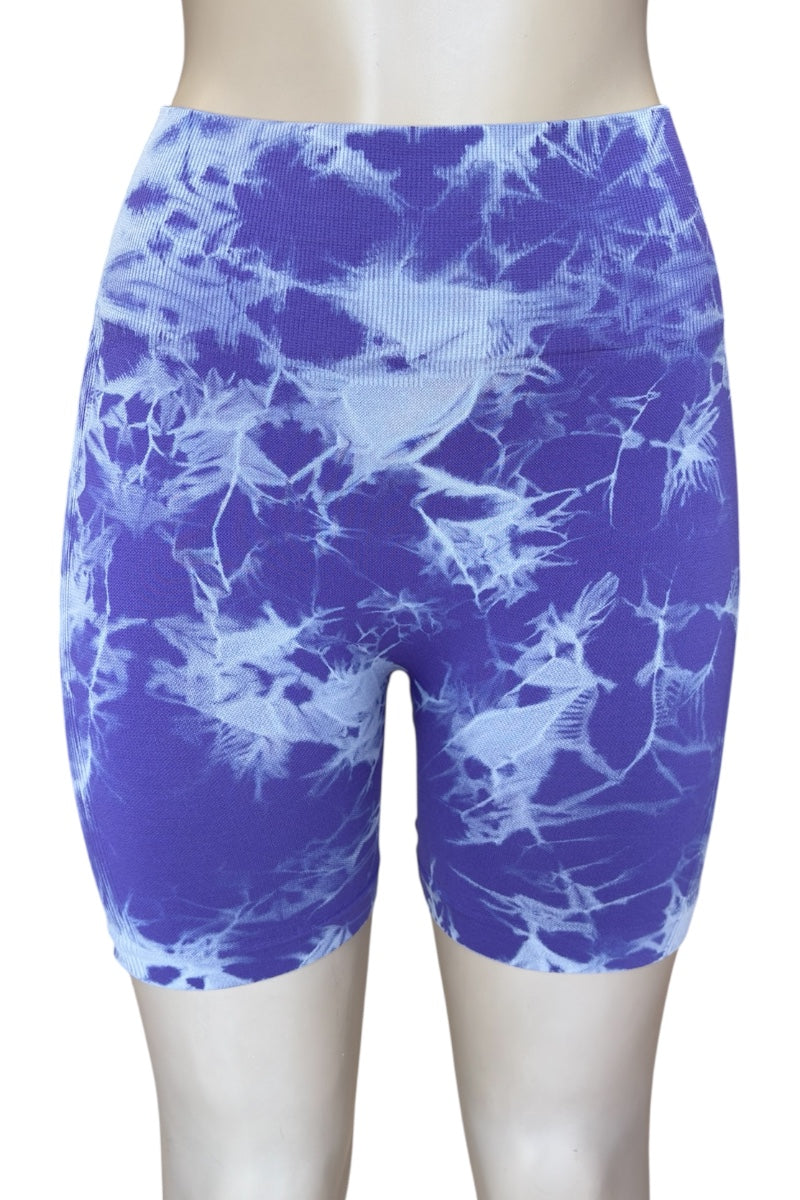 Purple patterned shorts on a plain background