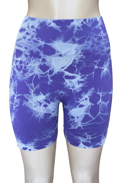 Purple patterned shorts on a plain background