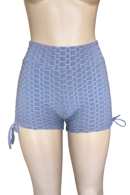 Grey patterned shorts on a mannequin with a white background