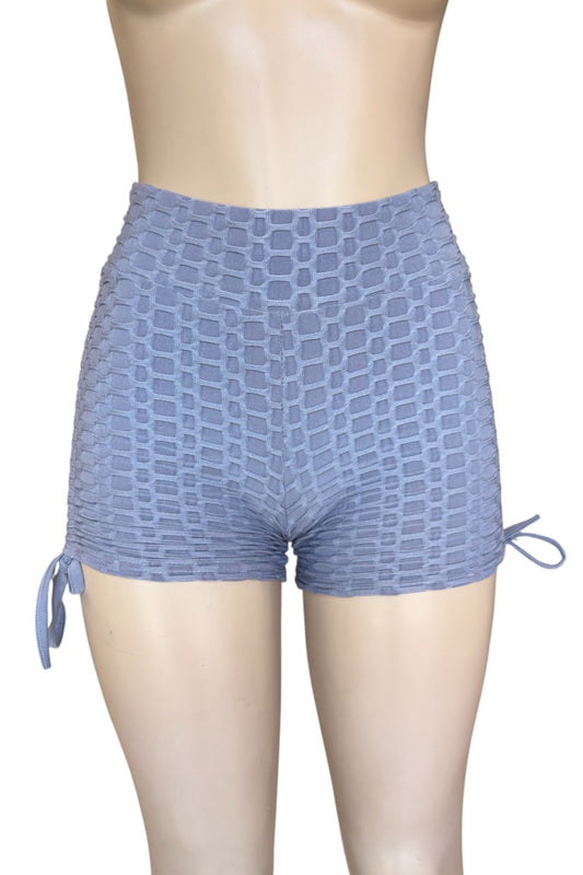 Grey patterned shorts on a mannequin with a white background