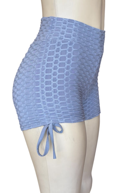 Grey textured skirt on a mannequin against a white background
