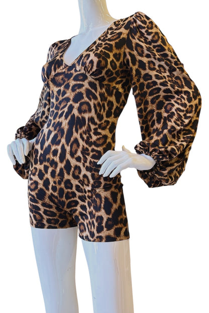 A leopard-print romper displayed on a white mannequin against a plain white background. The romper features a brown, black, and beige animal print pattern with dramatic, voluminous puff sleeves and a V-neckline.