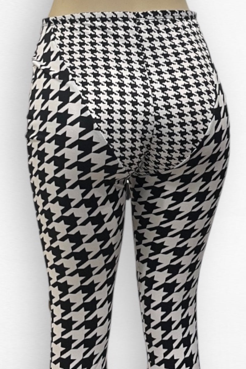 Houndstooth patterned pants on a white background