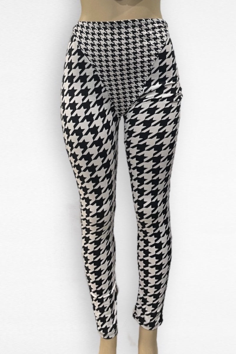 Houndstooth patterned leggings on a white background