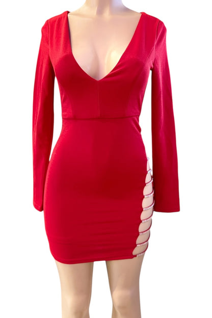 Red dress with long sleeves and cut-out sides on a mannequin against a white background