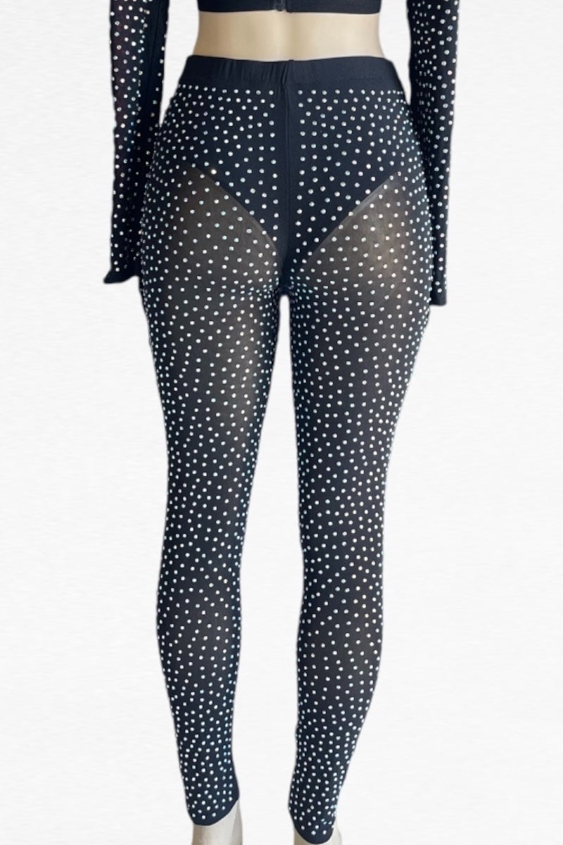 Black rhinestone leggings with sheer pattern on a white background