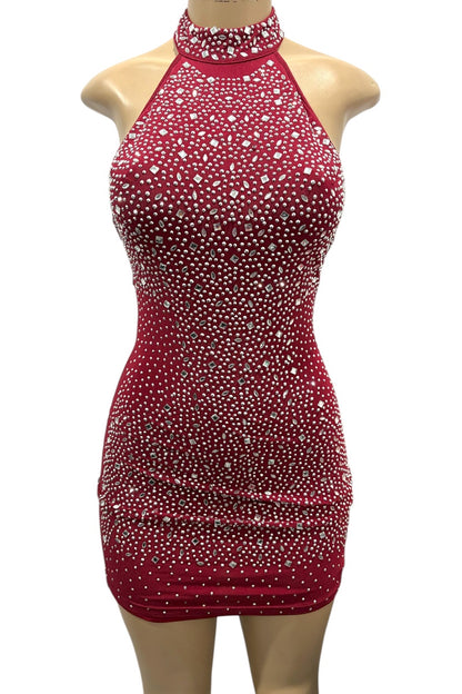 Burgundy dress with rhinestone embellishments on a mannequin against a white background