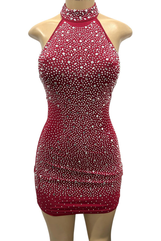 Burgundy dress with rhinestone embellishments on a mannequin against a white background