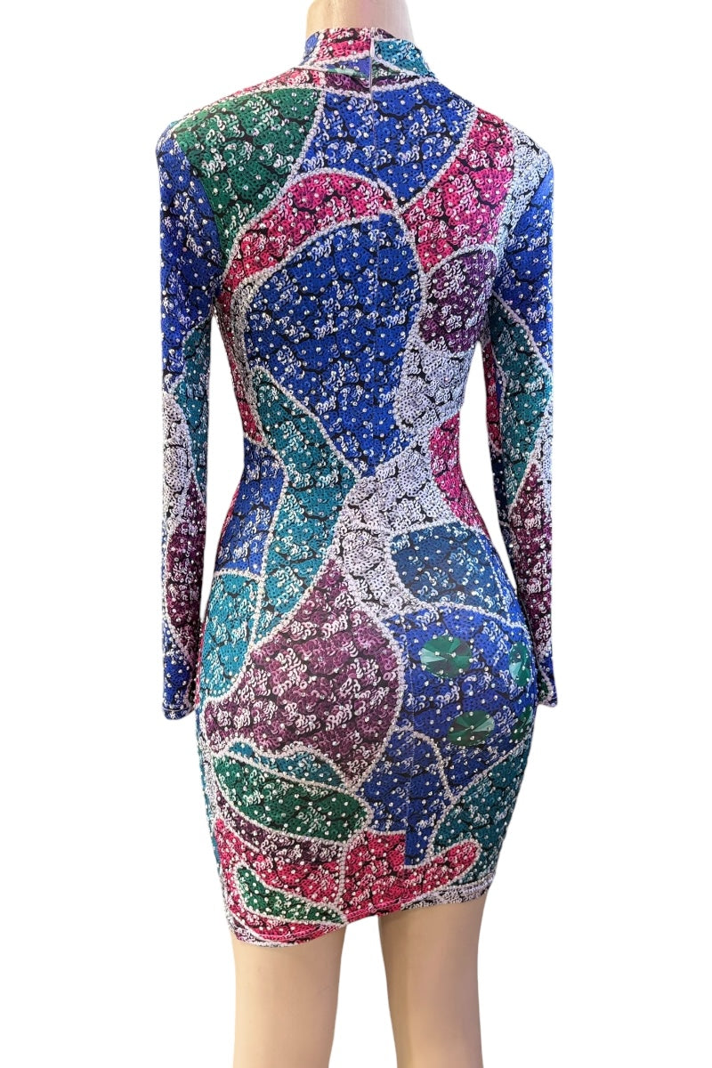 Colorful patterned dress on a mannequin against a white background