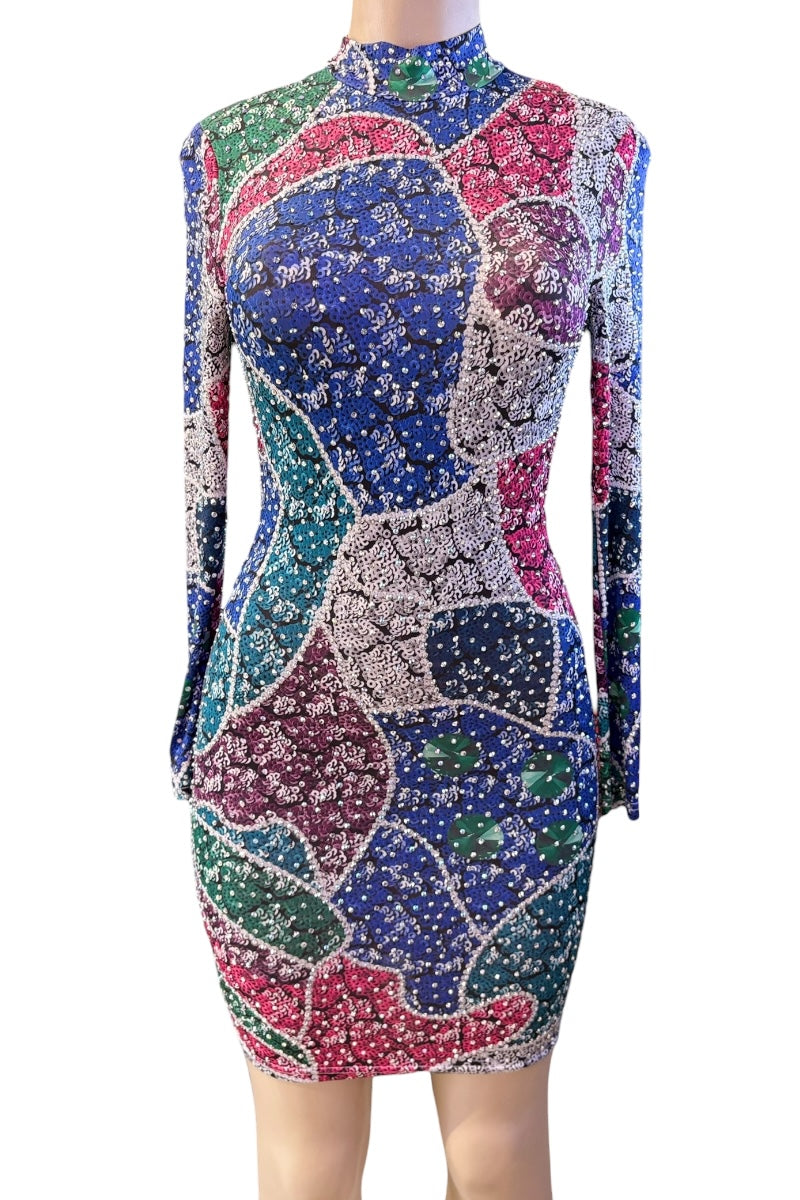 Colorful patterned dress on a mannequin against a white background