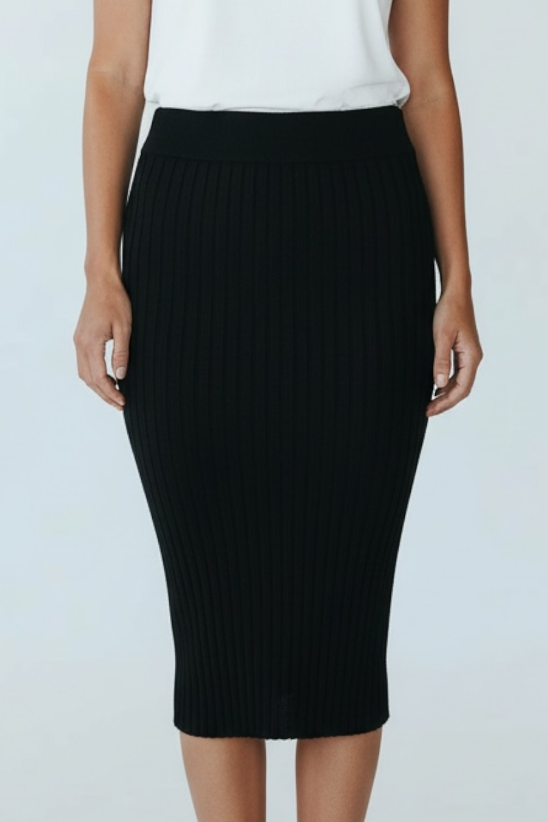Black pencil skirt worn by a person on a light gray background