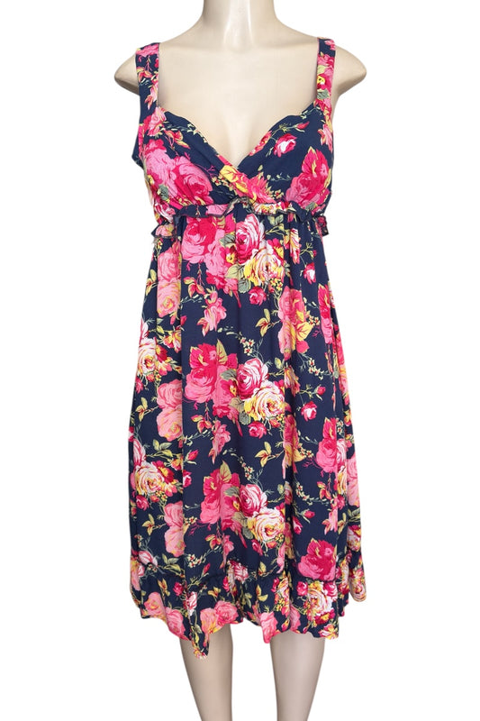 Floral dress on a mannequin against a white background