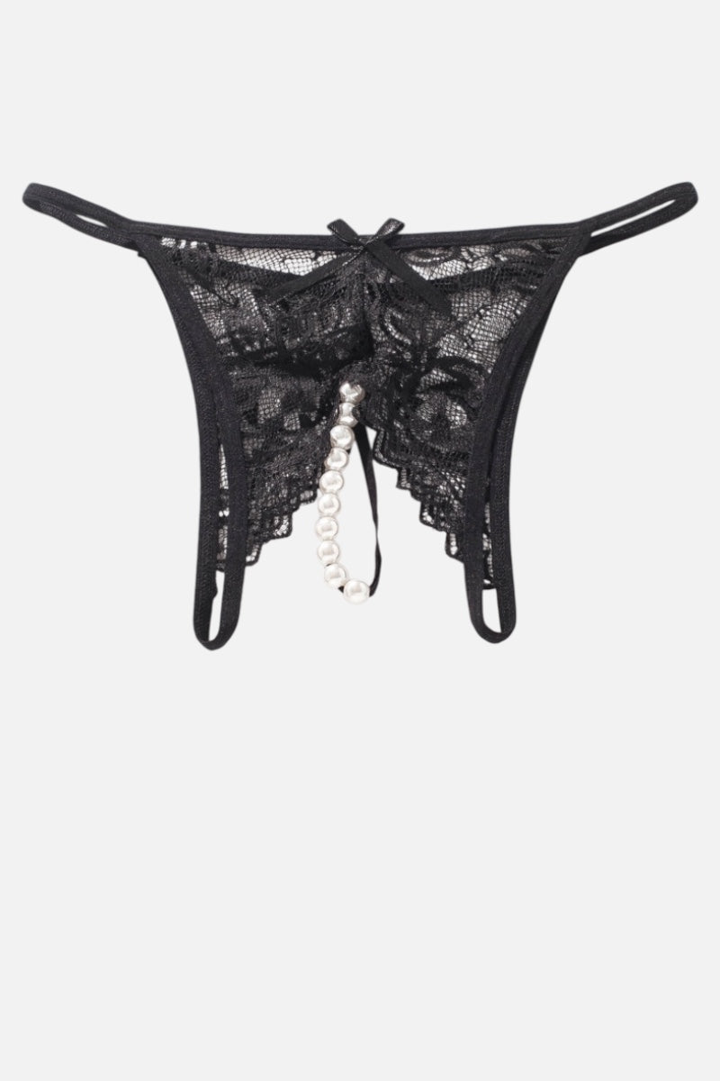 Black lace thong with a dangling pearl bead chain and bow detail, shown flat against a light gray background.